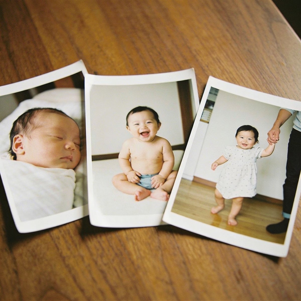Side-by-side comparison of baby photoshoot styles from newborn through to twelve months, illustrating how each age differs